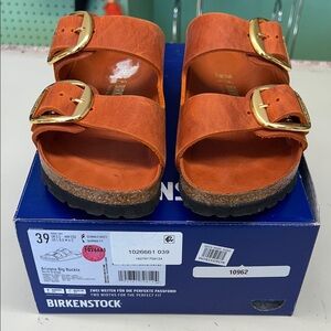 Birkenstock Sandals in Orange with Gold Buckles. Narrow fit size 39